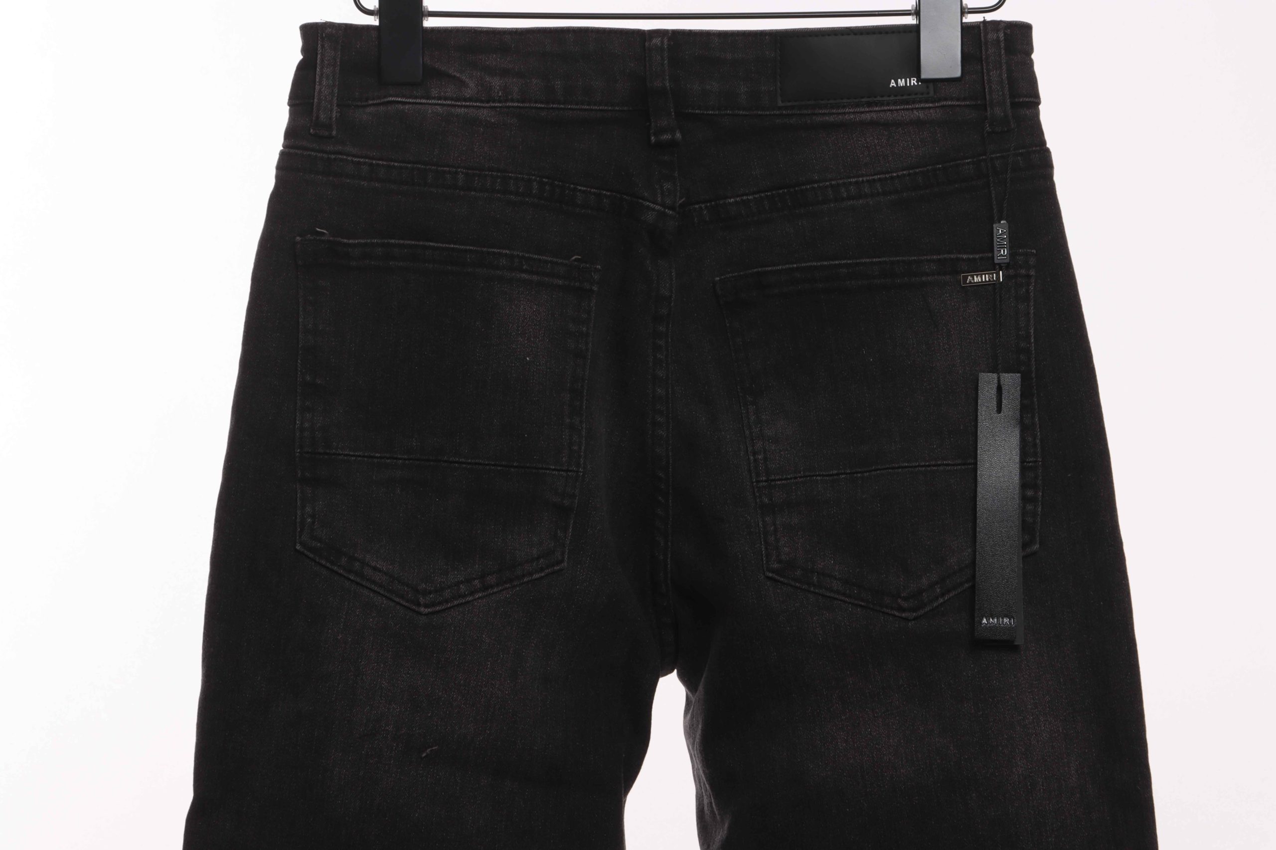 amiri_distressed_patch_decorated_denim_trousers_1B8BF50078A14.jpg